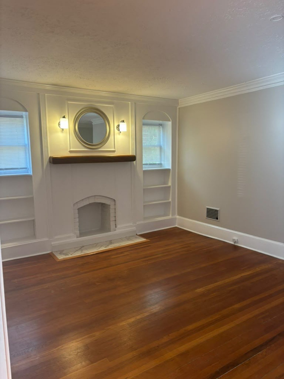 Refined interior painting with crisp white trim and warm wood floors